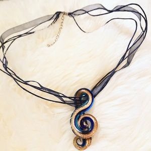 Blown glass music note necklace